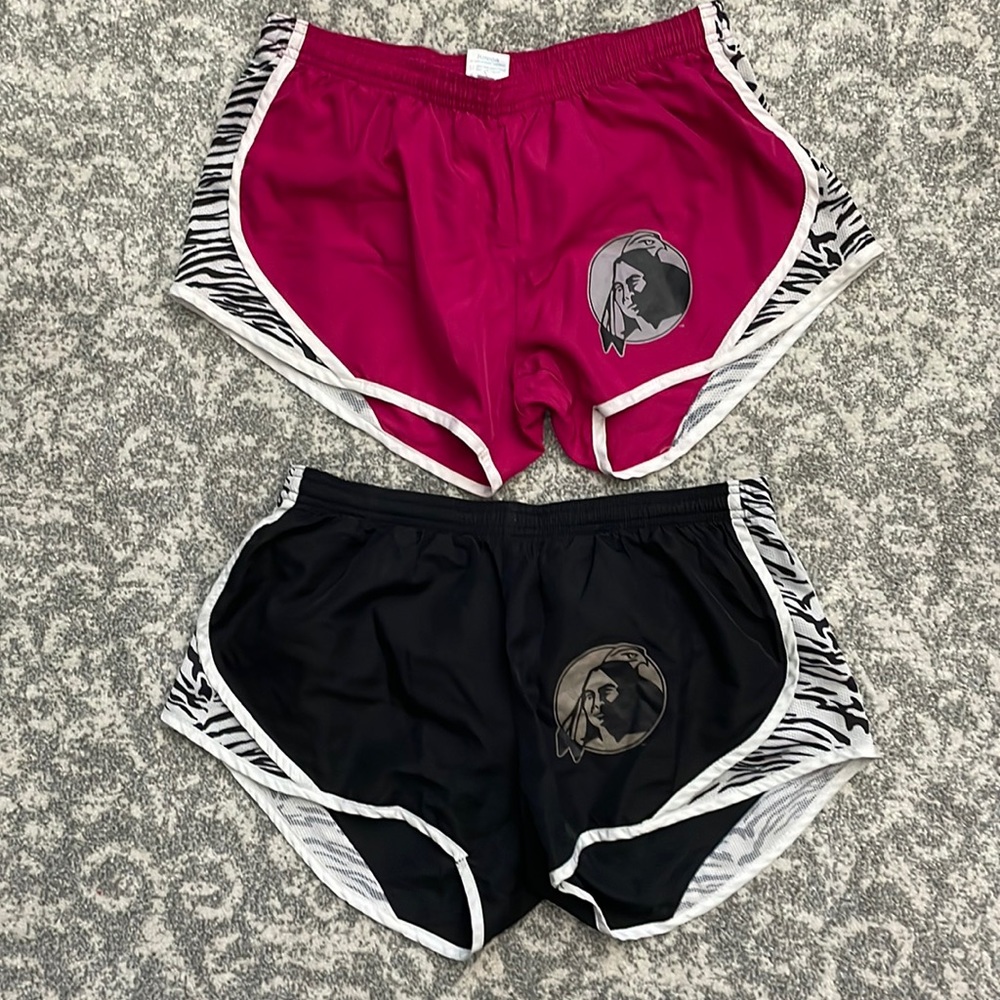 UNCP Shorts in fuchsia pink and black. Both lined with zebra stripe on sides.